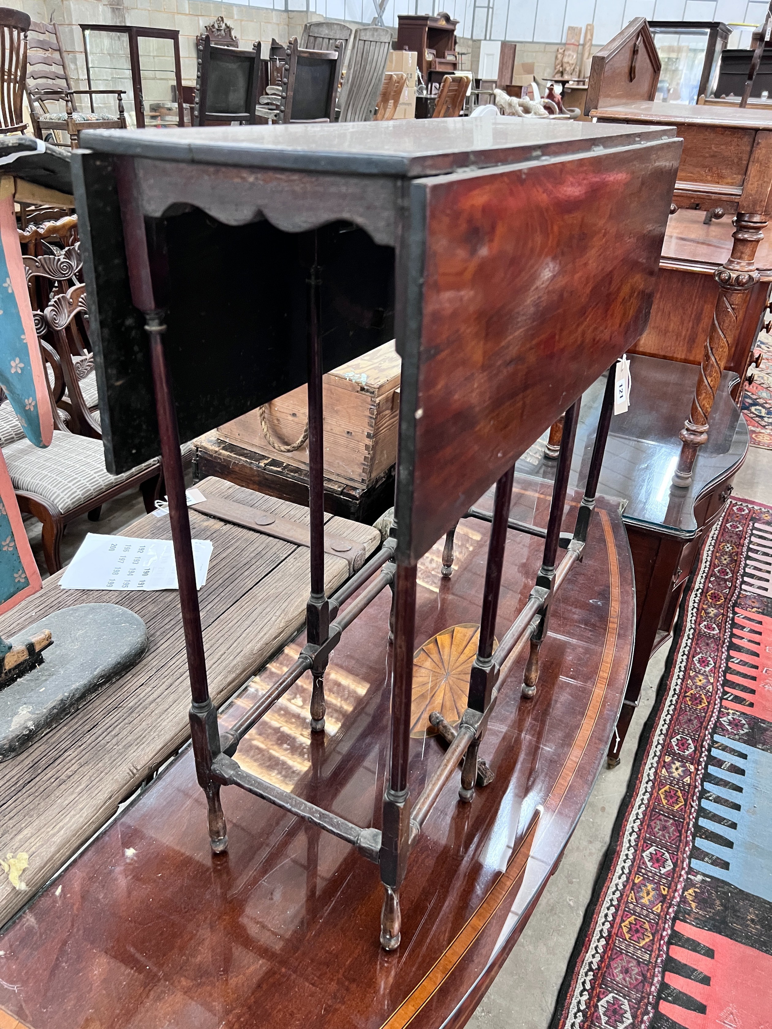 A mahogany spider leg table, width 71cm, depth 27cm, height 71cm *Please note the sale commences at 9am.